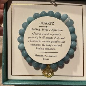 Shivam Blue Quartz Bracelet New in box Goldtone flower charm stretch
